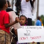Child at Mike Brown protest. Photo: Ibtimes.co